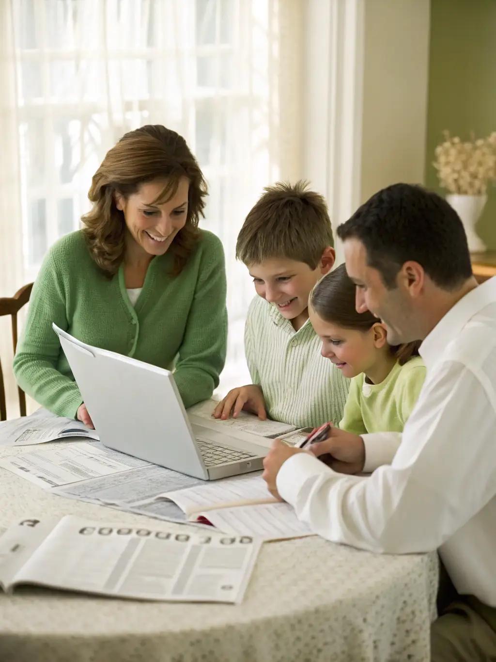 A South African family happily planning their future finances together, emphasizing the importance of family financial security and legacy planning.